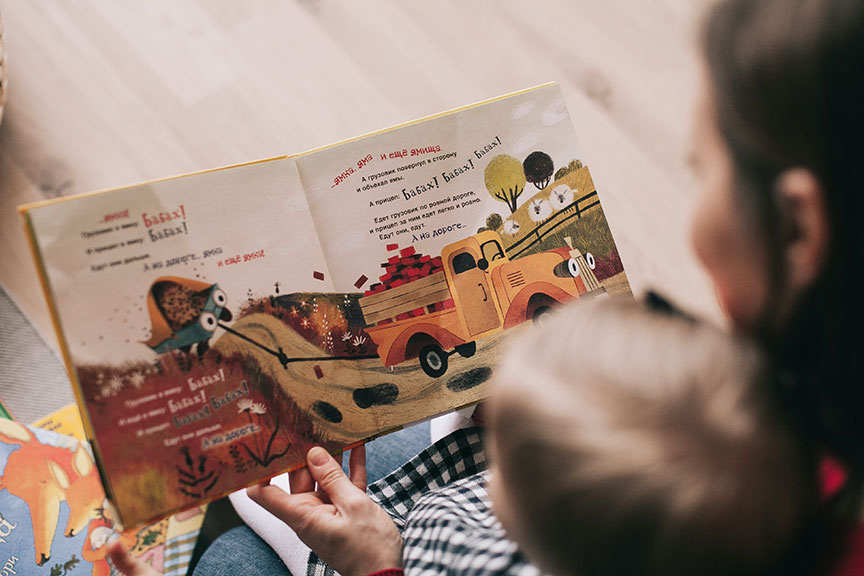 mother reading to her baby